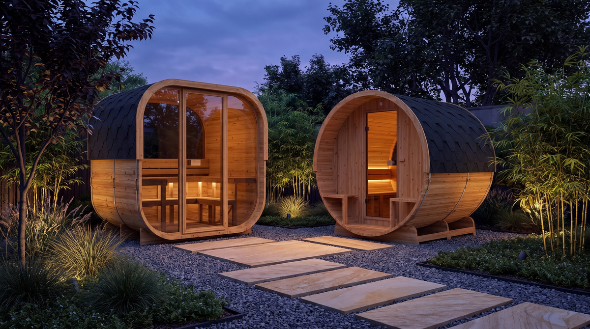 Las saunas exteriores Cube 160 y Barrel 210 en un jardín zen al anochecer